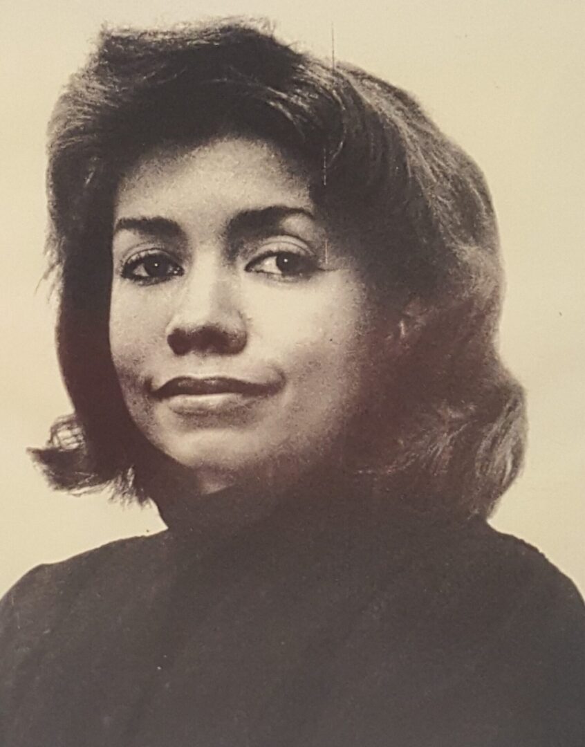 Black and white portrait of a woman with medium-length hair.