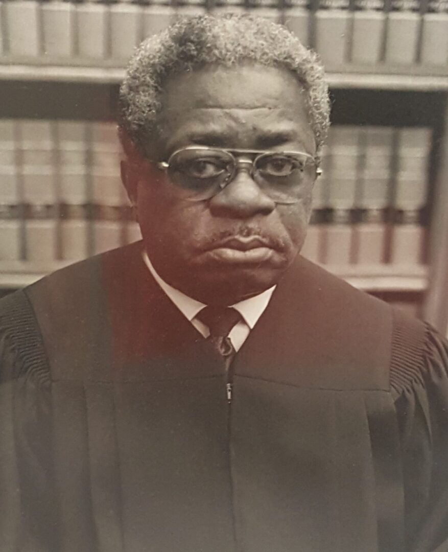 Portrait of a serious judge in a courtroom setting.