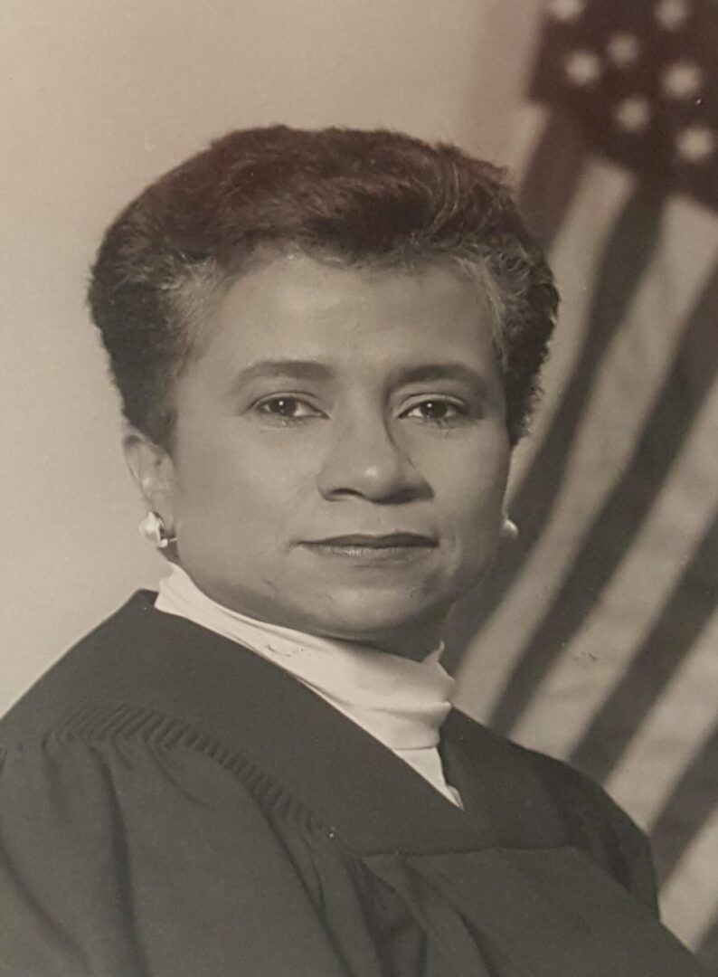 Portrait of a dignified judge in formal attire.