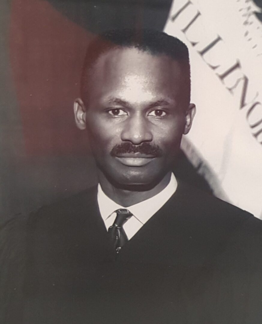 Black and white portrait of a man in formal attire.