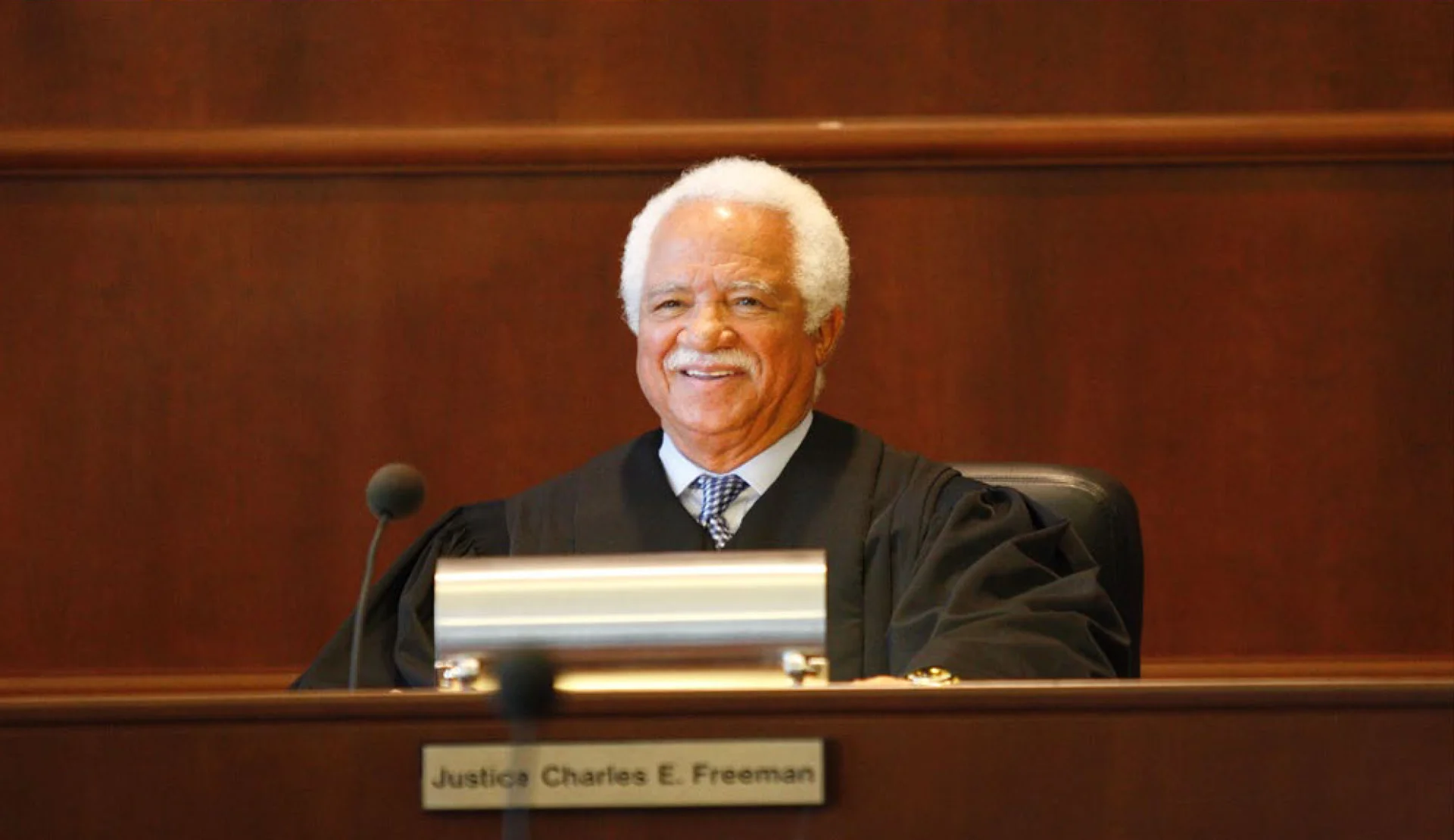 Judge Charles E. Freeman in courtroom attire.