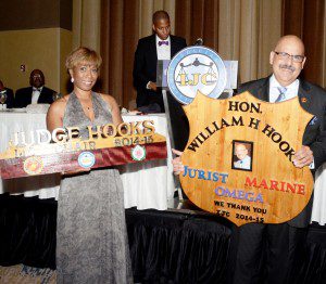 Honorees displaying custom wooden awards