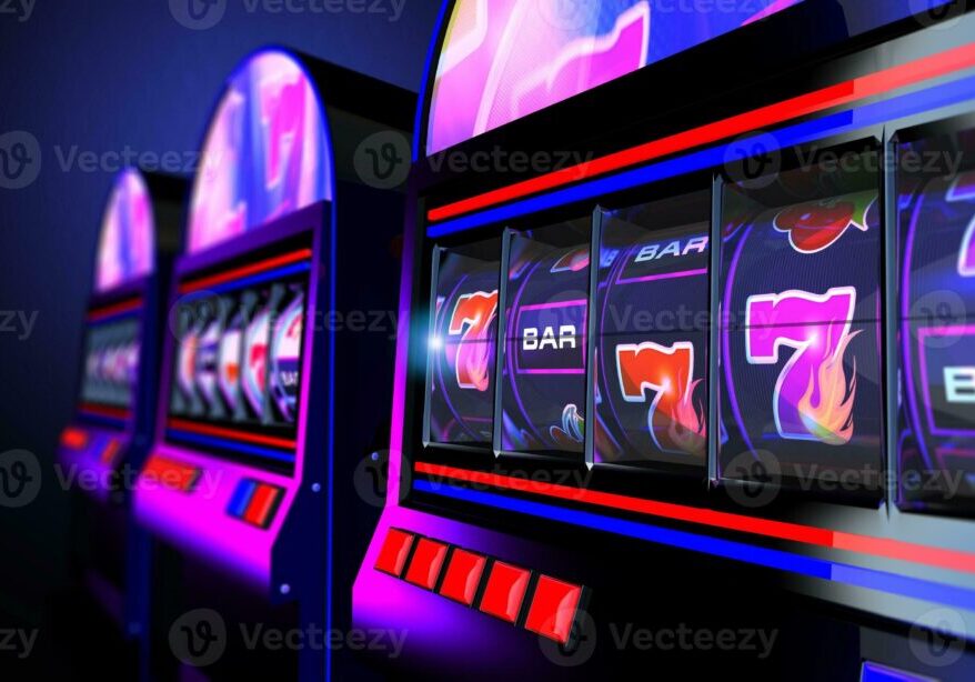 Close-up of colorful slot machines with vibrant lights in a casino.