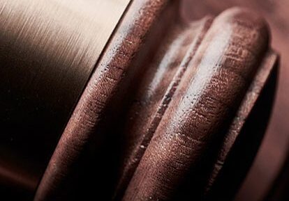 Close-up of a wooden judge's gavel and sound block.