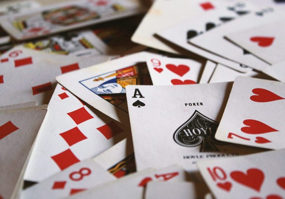 Close-up of scattered playing cards including an Ace of spades.
